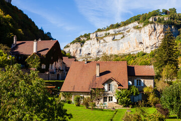 Fototapeta na wymiar Houses in mountains area, Baume les Messieurs village. Townscape in Jura, France, Europe.