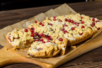 sliced ​​homemade grated pie with berries