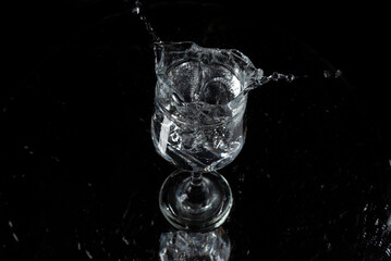 A splash with water and ice on a black background