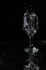 A splash with water and ice on a black background