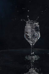 A splash with water and ice on a black background