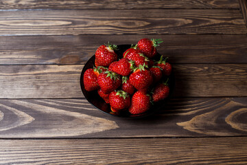 fresh, ripe strawberries in a plate