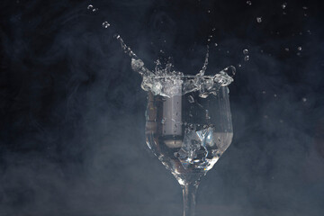 A splash with water and ice on a black background
