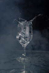 A splash with water and ice on a black background