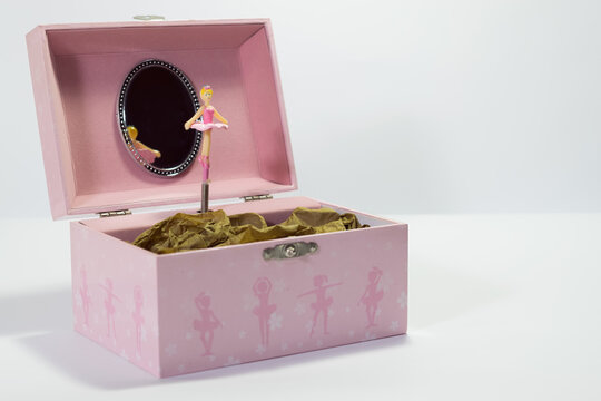 Musical box with doll to store jewelries inside.