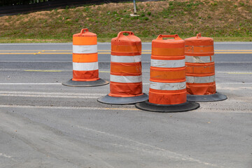Collection of traffic safety barrels, road construction safety zone, horizontal aspect