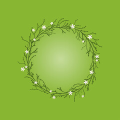 Wreath from branches, twigs and white flowers on green background.