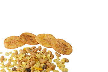 Pile of granola and dried banana slices coated honey with copy space on white background.