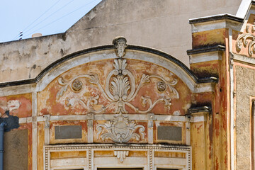 Obraz premium pediment of a ruined shipowner's building facade in Olhao, Algarve