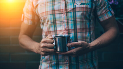 young man holding coffee cup. Coffee. Good morning. 