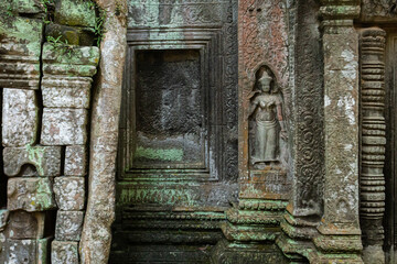 Fototapeta na wymiar Colors, textures shapes and patterns adorn a bas-relief statue at angkor wat temple cambodia