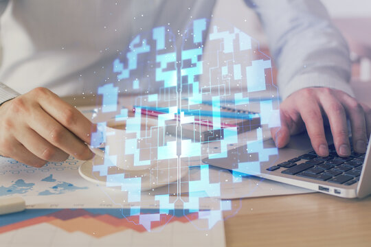 Double exposure of data internet theme hologram with man working on computer on background. Concept of innovation.