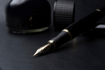 Beautiful fountain pen. under exposed photo on a black background