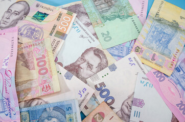 Obraz premium background with different Ukrainian hryvnia. View from above.