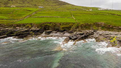 Beautiful view of Valentia Island Lighthouse at Cromwell Point. Scenic Irish countyside on sunny summer day, County Kerry, Ireland.
