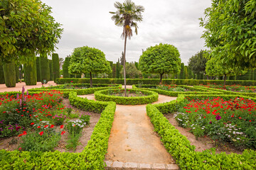 View of the flowery gardens of the Alcázar de los Reyes Cristianos in Cordoba, Spain.