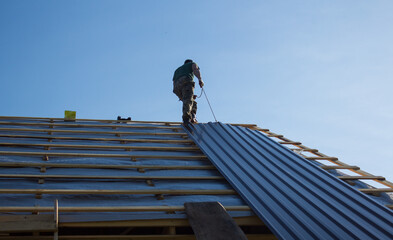 Construction work on the roof of an apartment house in the open air