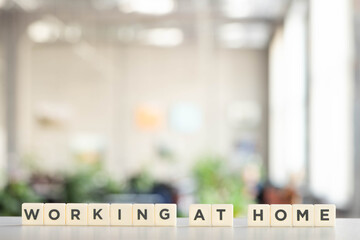 white cubes with working at home lettering on white desk