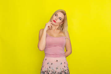 Blonde woman in pink summer shorts and shirt