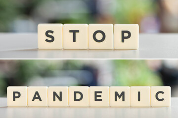 white cubes with stop pandemic lettering on white desk, covid-19 concept