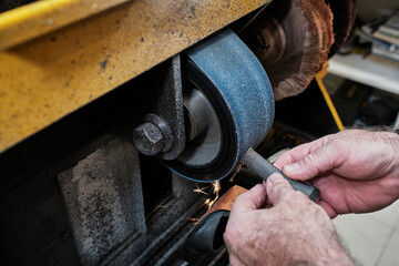 shoemaker man working in his shoe shop