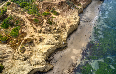 Surfers on the cliffs
