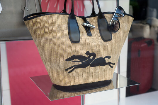 Mulhouse - France - 2 June 2020 - Closeup of summer handbag by longchamp in a luxury fashion store showroom