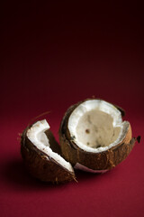Incredibly beautiful open coconut on a burgundy background