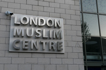 Obraz premium Close up of London Muslim Centre entrance with Islamic Andalusian tiled art. Largest Islamic centre Mosque in UK. Muslims worshippers gather for prayer & services