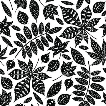 Different leaves types silhouettes isolated on background seamless pattern. Repeating vector illustration with foliage in trendy modern colors.