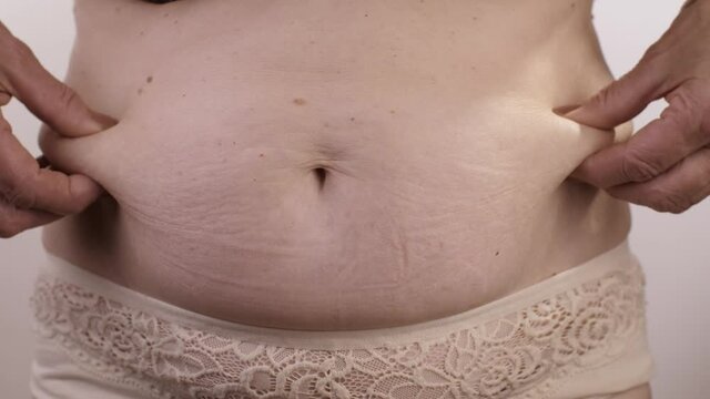 Fat belly of a woman
