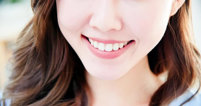 asian woman has toothy smile