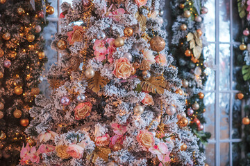 Decorated Christmas tree on blurred, sparkling and fairy background