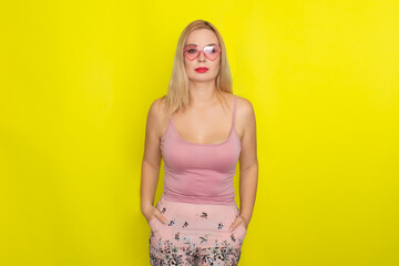 Blonde woman wearing sunglasses like hearts