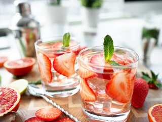 Glasses with alcoholic cocktails stand on table