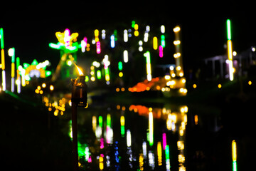 Lamp light with beautiful bokeh light background in Temple fair in Thailand