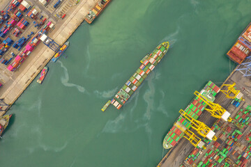 Fototapeta na wymiar Container ship in export and import business and logistics. Shipping cargo to harbor by crane. Water transport International. Aerial view and top view.