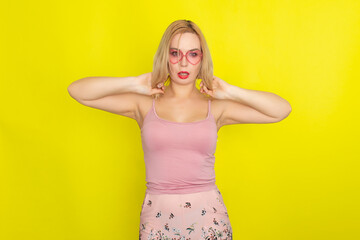 Blonde woman wearing sunglasses like hearts