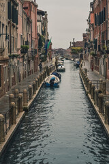 Fototapeta na wymiar Venetian canal between the old houses of the city.