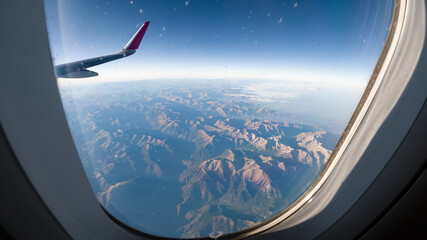 View of the Pyrenees from the porthole of an airplane