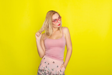 Blonde woman wearing sunglasses like hearts