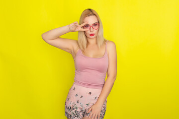 Blonde woman wearing sunglasses like hearts