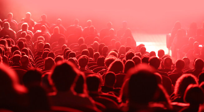 Heads Of People During Concert And Red Lights