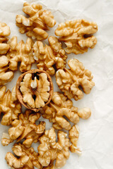 Peeled walnut kernels close-up, top view. Vertical photo.