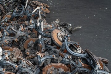used brake rotor and car part at junkyard or scrapyard for recycling
