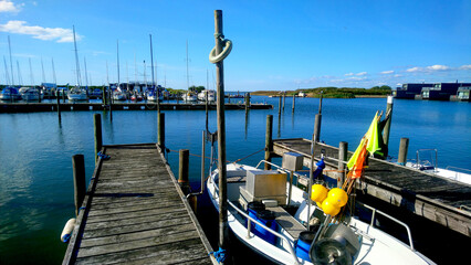 Boats drop at  the harbor in summer time no people with blue sky and sea background