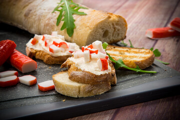 cheese sandwich and crab sticks on top