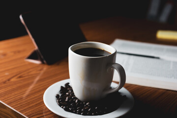 Cup of coffee with coffee beans,education concept