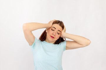 portrait of a girl with a headache isolated on a white background. Space for text