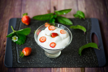 sweet homemade yogurt with red ripe fresh strawberries